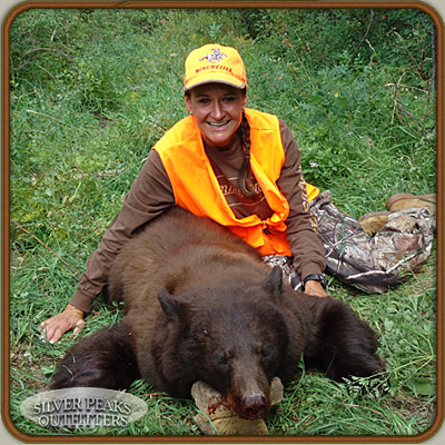 Rhonda with her first Bear, a gorgeous chocolate color phase Colorado Black Bear. Our Bear Hunts put you in the right place at the right time for maximum success.