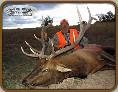 Frank & his 6 pt Colorado Trophy Elk taken with the muzzleloader from Silver Peaks Outfitters Archery and Muzzleloader Hunting Camp #3