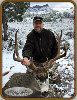 Chris with his first Muley Buck taken on the 1st day of his hunt with Silver Peaks Outfitters